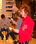 Stan at Hustler reading Caning Able - spiky orange/red - 2003 - Photo by Cyn