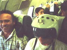 Stan with Mig fighter pilot helmet over pinko hair on Aeroflot flight to Moscow - the crew were not amused - 1999